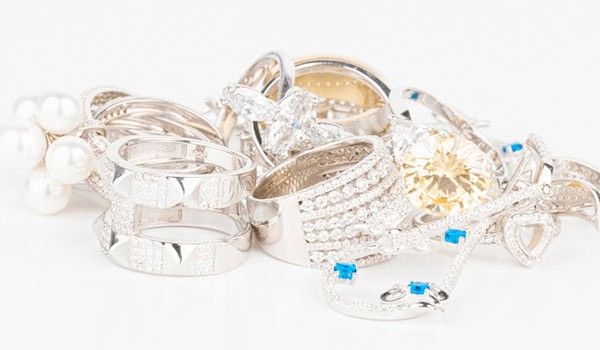 Shiny collection of diamond, gold, and pearl jewelry including rings, necklaces, and bangles from David Stern Jewelers. Perfect for engagement, wedding, or special occasions.