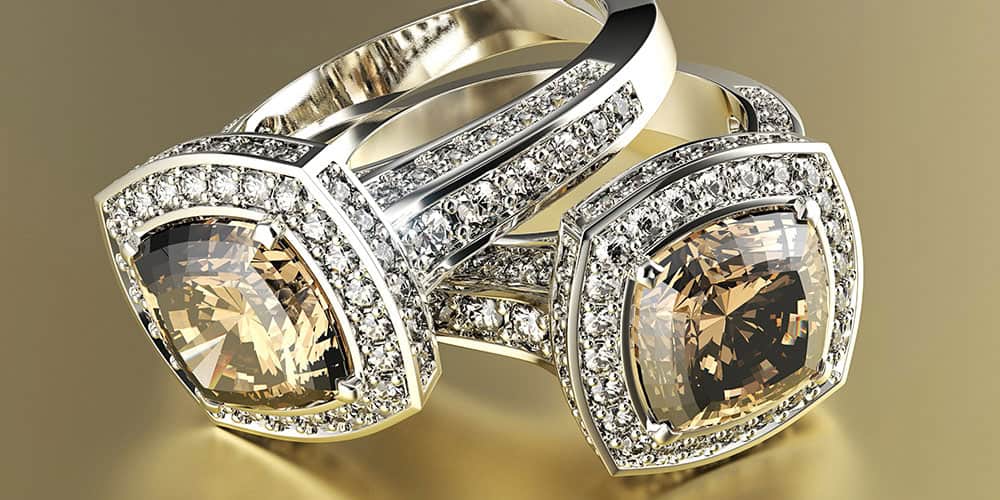 Luxurious champagne-colored gemstone rings surrounded by sparkling diamonds, crafted with high-quality sterling silver and gold, perfect for elegant jewelry collections and special occasions.