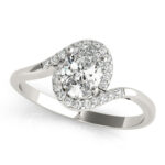 A stunning diamond engagement ring featuring a central round brilliant cut diamond surrounded by a halo of smaller diamonds, set in polished white gold.