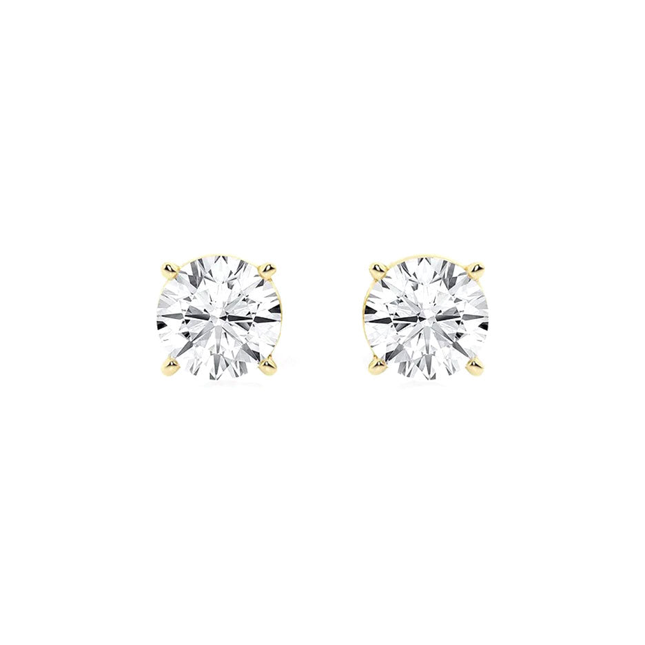 Sparkling diamond stud earrings with yellow gold prongs, perfect for elegant jewelry and gift-giving. Designed for women seeking timeless, high-quality diamond jewelry.