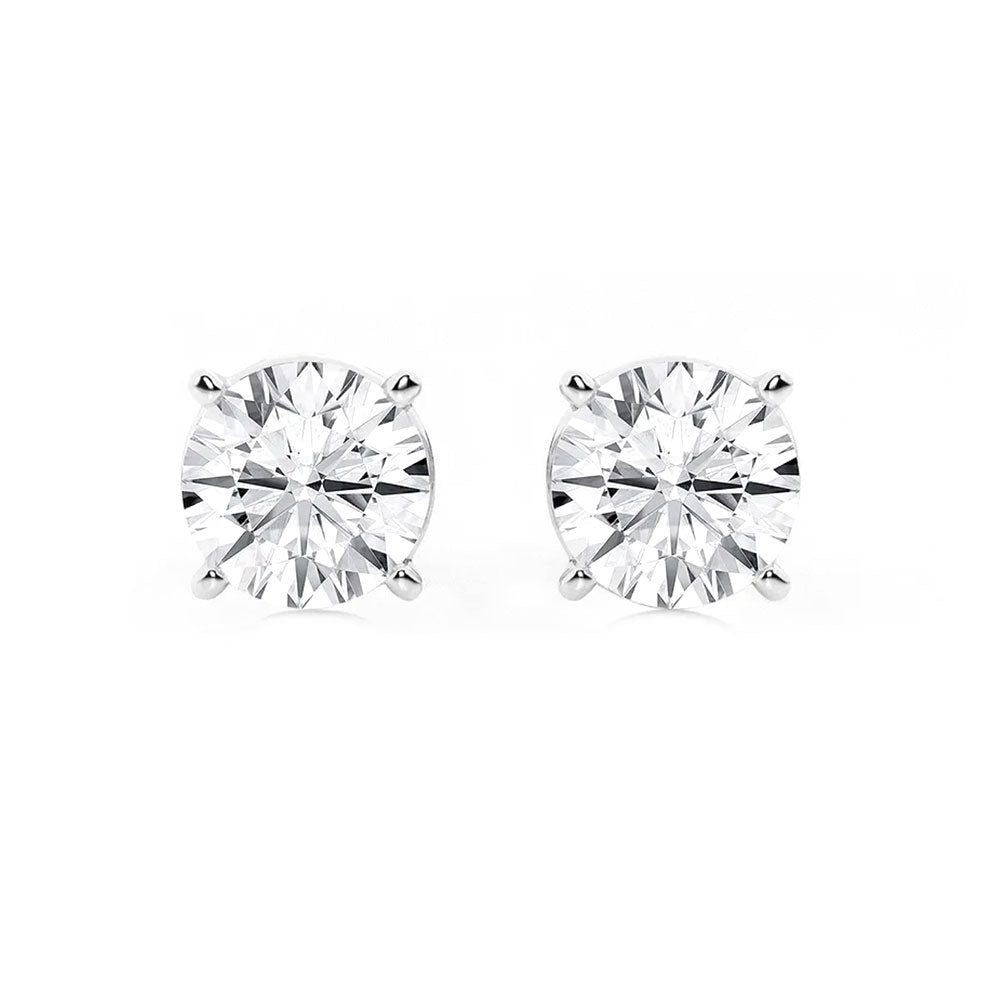 Sparkling round-cut diamond stud earrings in white gold setting, perfect for engagement or daily jewelry, showcasing timeless beauty and craftsmanship.