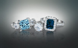 Elegant diamond and blue gemstone rings showcasing fine jewelry craftsmanship at David Stern Jewelers, perfect for engagement or special occasions.
