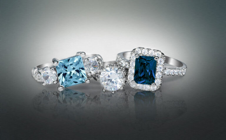 Elegant diamond and blue gemstone rings showcasing fine jewelry craftsmanship at David Stern Jewelers, perfect for engagement or special occasions.
