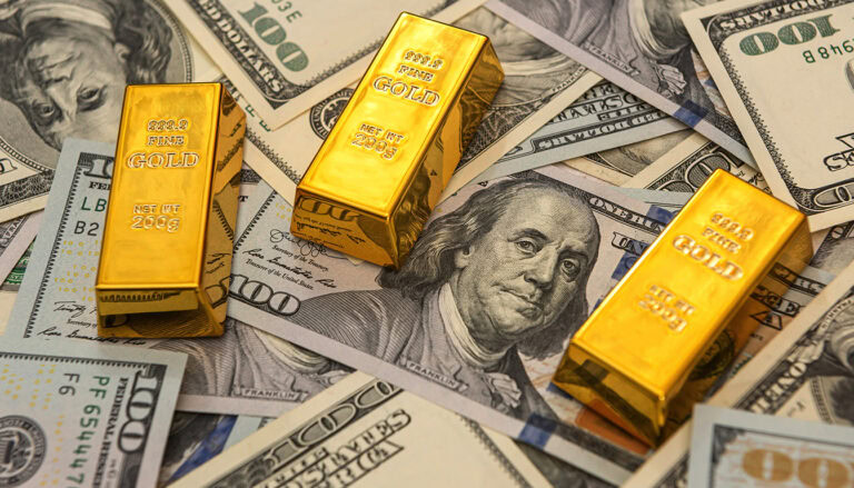 Gold bars and US dollar bills arranged on a surface, representing cash for gold jewelry at David Stern Jewelers.
