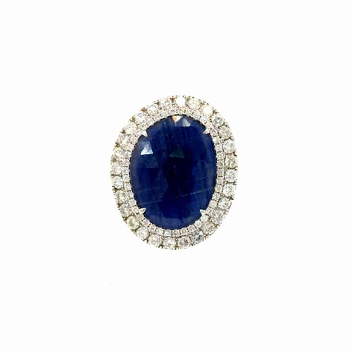 Oval sapphire halo ring seen head on: an 8.00 ct faceted oval blue sapphire inside two rows of round diamonds in 14kt white gold