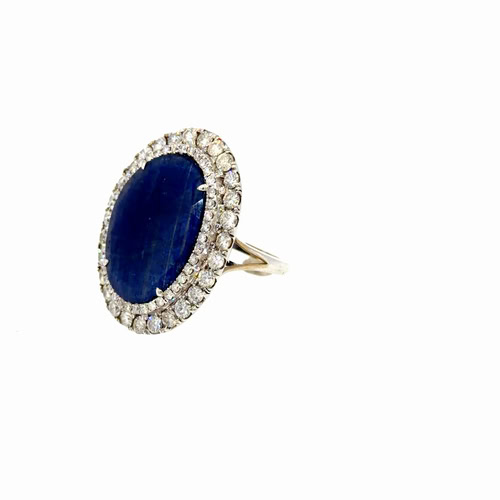 Side view of the 8 carat sapphire ring, showing the double diamond halo and the split shank in 14kt white gold