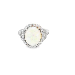 Oval opal halo ring seen head on: a 4.50 ct white opal cabochon inside a round diamond halo in 14kt white gold