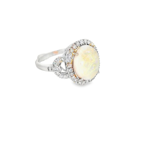 The opal and diamond ring from an angle, showing the diamonds continuing down the shoulders