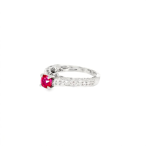 The ruby and diamond ring from the other side, showing the milgrain detail along the band