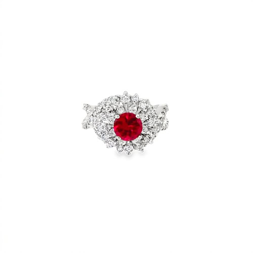 Lab grown ruby cocktail ring seen head on: a 1.00 ct round lab-grown ruby inside a starburst halo of diamonds