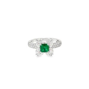 Emerald floral ring seen head on: a square Colombian emerald framed by four marquise diamond petals in 18kt white gold