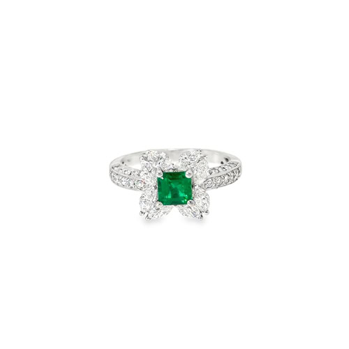 Emerald floral ring seen head on: a square Colombian emerald framed by four marquise diamond petals in 18kt white gold