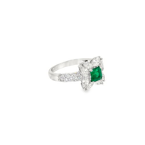 The emerald floral ring from the other side, showing the marquise petals and the diamond-set shoulders