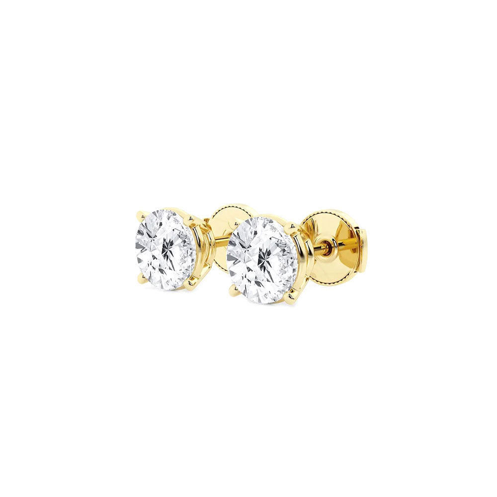 Side view of the yellow gold lab diamond studs showing the four-prong baskets and screw-style backs