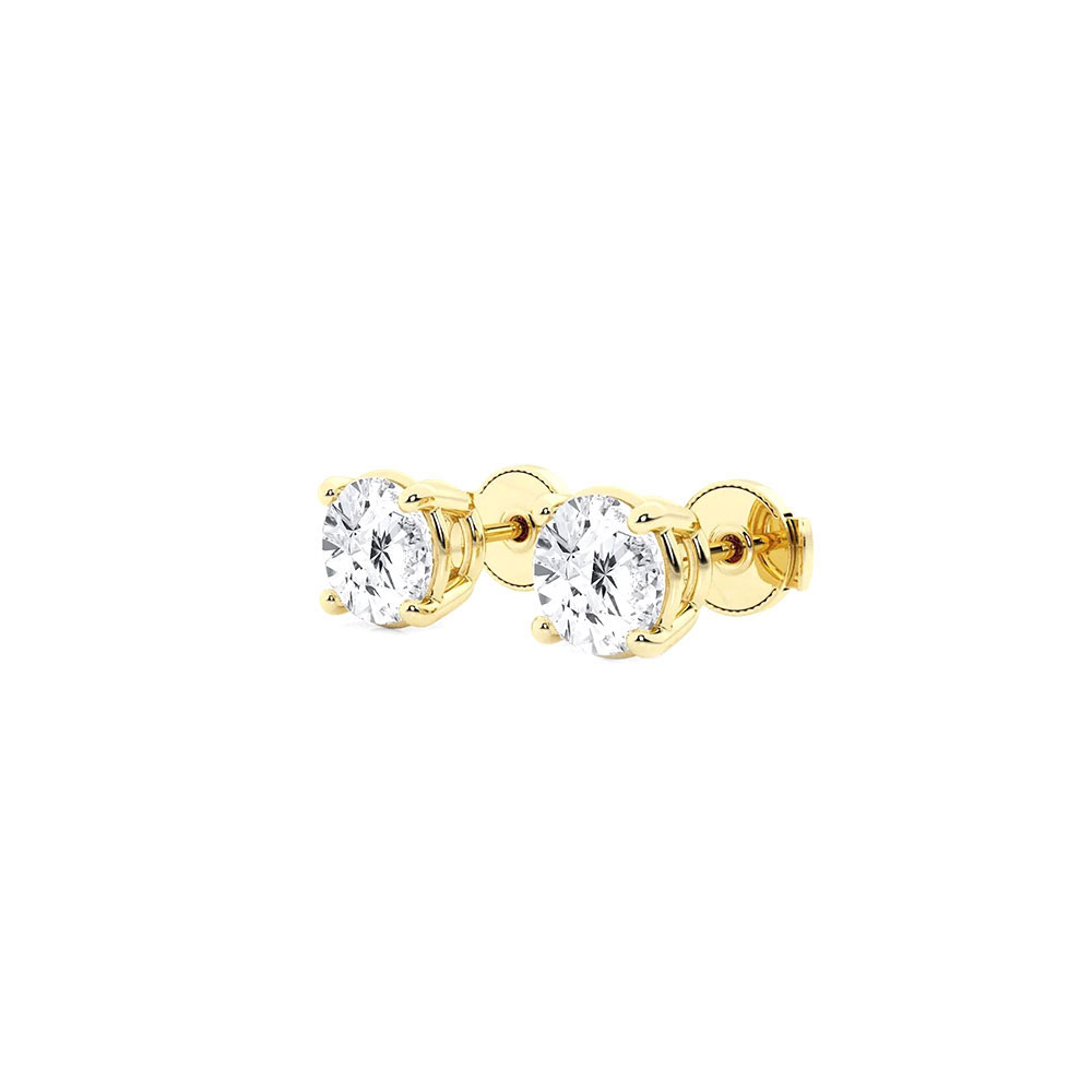 Side view of the yellow gold diamond studs showing the four-prong basket setting and screw-style backs