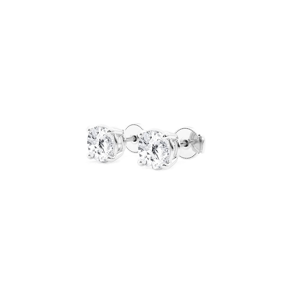 Side view of the white gold four prong studs showing the basket setting and screw-style backs