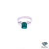 Chatham emerald engagement ring: 1.40 ct emerald-cut Chatham lab-created emerald between two tapered baguette diamonds in platinum