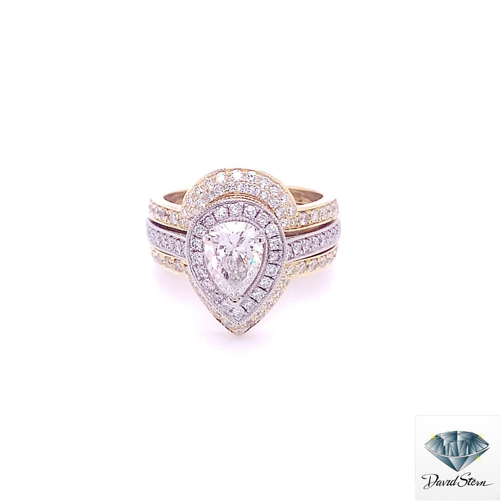 Pear halo engagement ring: 1.05 ct pear diamond in a white gold pave halo, framed above and below by a yellow gold diamond ring enhancer