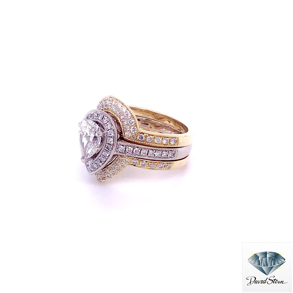 Two tone engagement ring set seen from the left: pear halo in white gold with a yellow gold diamond ring enhancer