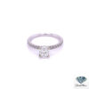 Oval cut engagement ring: 0.81 ct F color oval diamond in four prongs on a 14kt white gold band with a single row of diamonds