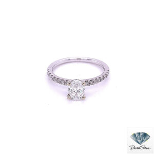 Oval cut engagement ring: 0.81 ct F color oval diamond in four prongs on a 14kt white gold band with a single row of diamonds