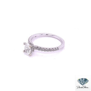 Side view of the diamond band engagement ring showing the single row of prong-set diamonds and the four-prong oval head