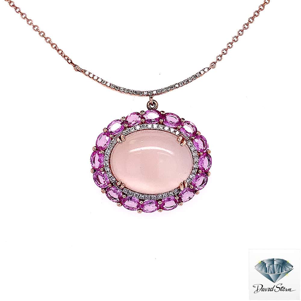 Rose quartz necklace: oval cabochon rose quartz with a diamond halo and pink gemstone halo in 14kt rose gold