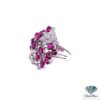 Side view of the ruby cocktail ring showing the tall ruby cluster and openwork gallery