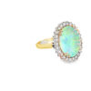 The blue green opal ring seen from the other side, showing the prong-set diamond halo and the yellow gold band