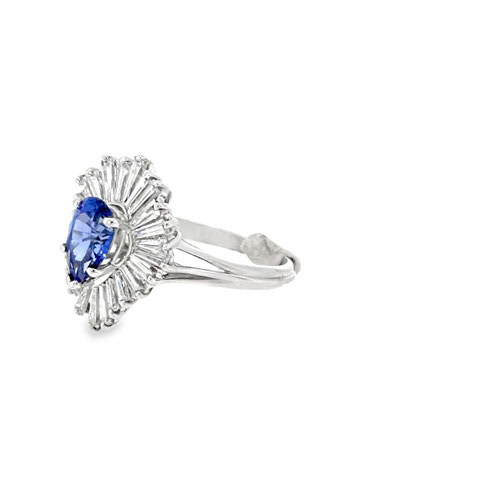 Side view of the sapphire ballerina ring showing the flared baguette diamond skirt and split shank