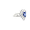 Other side of the pear sapphire ballerina ring showing the raised gallery and 18kt white gold split shank