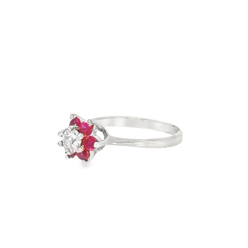 Side view of the ruby and diamond flower ring, showing the prong-set rubies and the slim 14kt white gold band