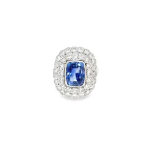 Cushion sapphire ring seen head on: a 2.35 ct cushion blue sapphire in a milgrain bezel inside a double halo of diamonds in platinum