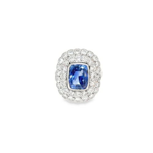 Cushion sapphire ring seen head on: a 2.35 ct cushion blue sapphire in a milgrain bezel inside a double halo of diamonds in platinum