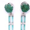 Sapphire and emerald earrings detail: sliced rough emerald tops above a ladder of emerald baguettes and diamond bars
