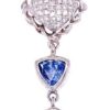 Pave diamond pendant detail: cushion-shaped pave diamond cluster in a rope frame above a bezel-set trillion tanzanite