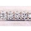 Horizontal bar necklace detail: fourteen round diamonds in shared prongs along a satin-finished white gold bar