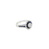 Royal blue sapphire ring from the other side, showing the scalloped diamond outline and tapering white gold band