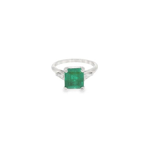 Platinum emerald ring: a 2.33 ct natural emerald cut emerald between two tapered baguette diamonds in platinum