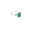 The three stone emerald ring from another angle, showing the tapered baguette diamonds beside the square emerald