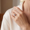 Styled image of the oval tanzanite and diamond ring worn on the hand