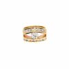 The 0.70 ct round brilliant diamond held in a trellis setting between two channel-set rows on a wide 14kt yellow gold band, the opening frame of its 360 degree video