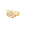 The wide band engagement ring at an angle, showing the layered channel-set rows and the faceted shank
