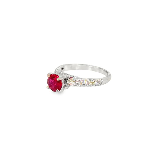 Side view of the lab grown ruby ring, showing the four prongs and the diamonds running down the shoulder