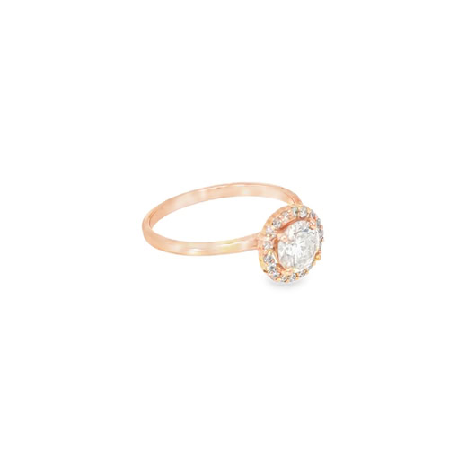 Angled view of the rose gold halo engagement ring, the halo head turned to show its profile against the thin rose gold band