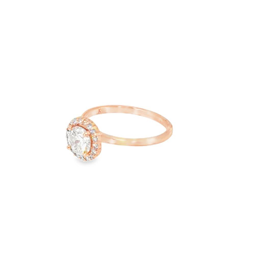 Side view of the rose gold halo engagement ring, showing the raised halo head sitting above the slim plain band