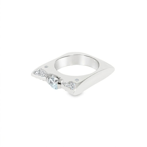 Side view of the modern engagement ring, showing the square tapered profile of the brushed 18kt white gold band
