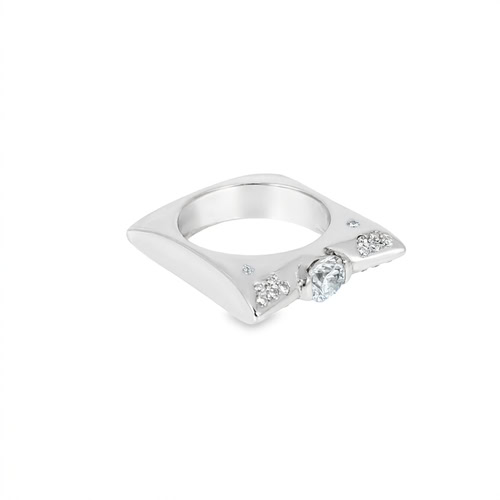 Angled view of the modern engagement ring, the square band turned to show its top plane and the flush-set diamond clusters either side of the center stone